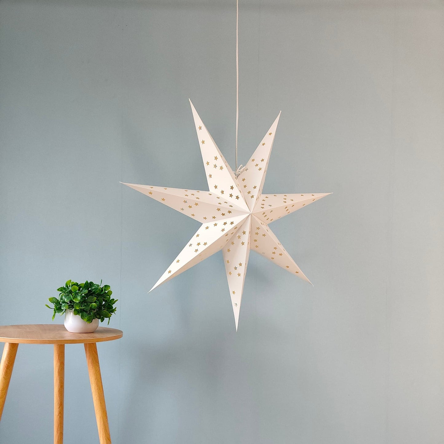 Side view of 17 inch white hanging paper star lantern for home decor