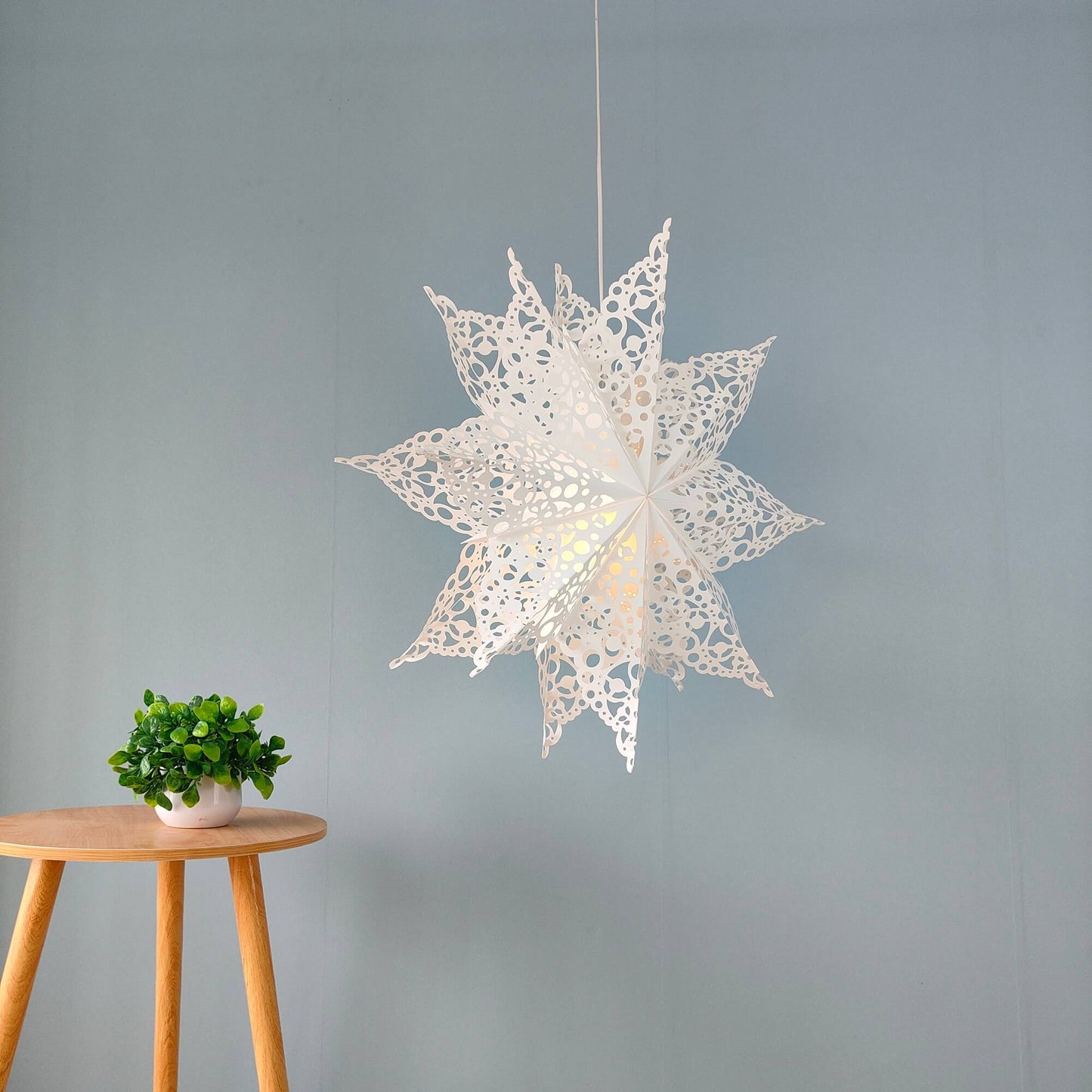 Close-up detail of 26 inch white paper snowflake lantern design